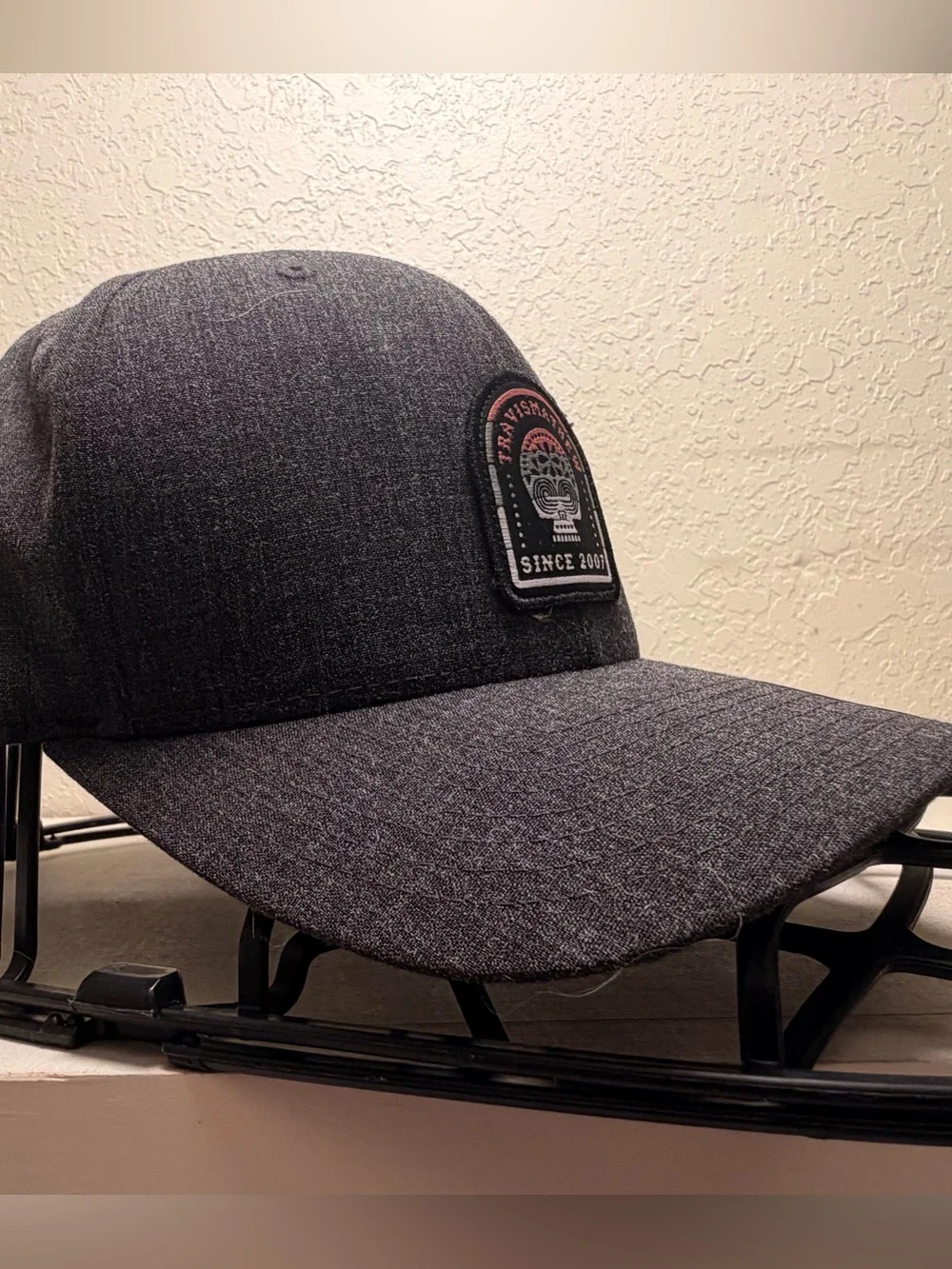 Travis Mathew Dark Gray Patch Baseball Cap with Black and White Logo